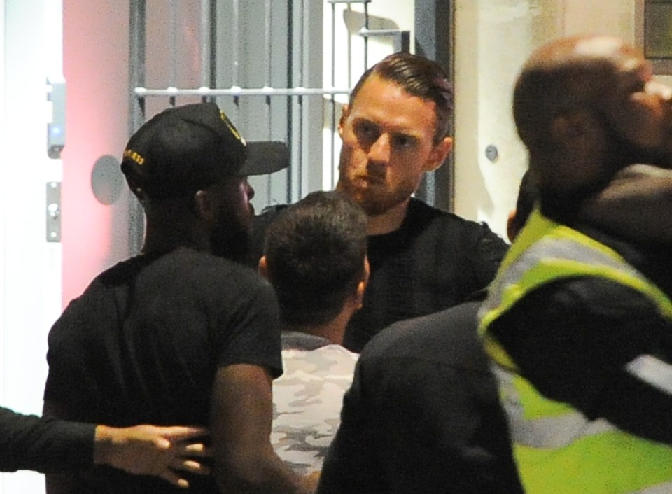  The former Sunderland star looked furious as security staff tried to calm the situation down