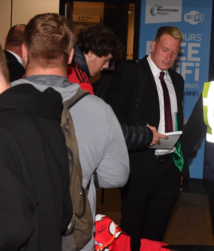  Phil Jones was caught by fans as Man Utd landed at around midnight