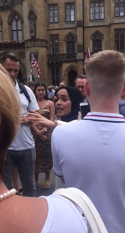  A Muslim woman was confronted in the streets by the Tommy Robinson supporters