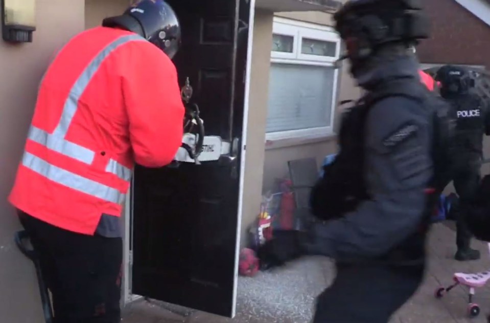 Police used a chainsaw to enter the front door of the house