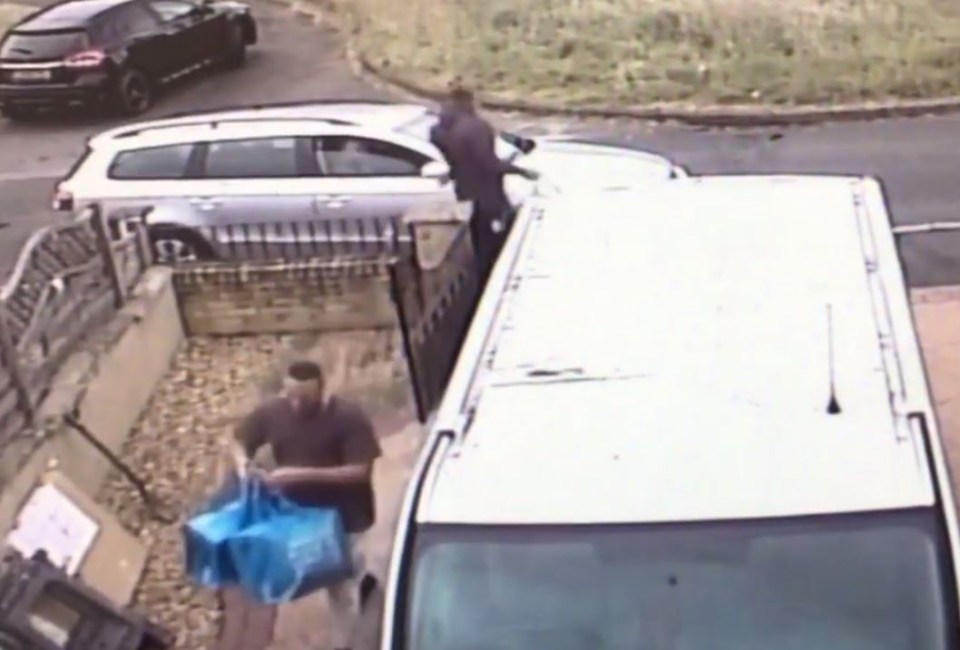 Two gang members can be seen entering the house carrying large bags in footage seized from the property’s CCTV cameras