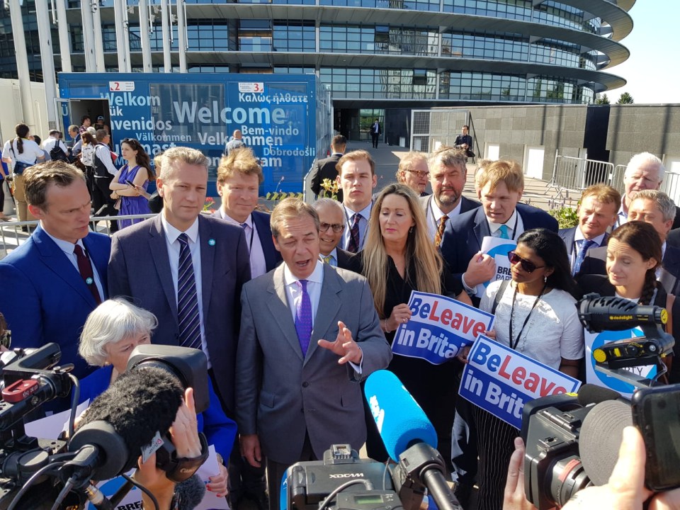 Nigel Farage leading the Brexit Party MEPs into the European Parliament for the first time