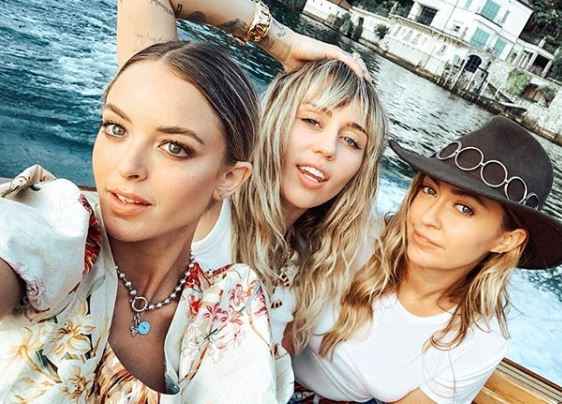 Miley is on the trip with her sister Brandi (R) and Brody Jenner’s ex, Kaitlynn Carter (L)