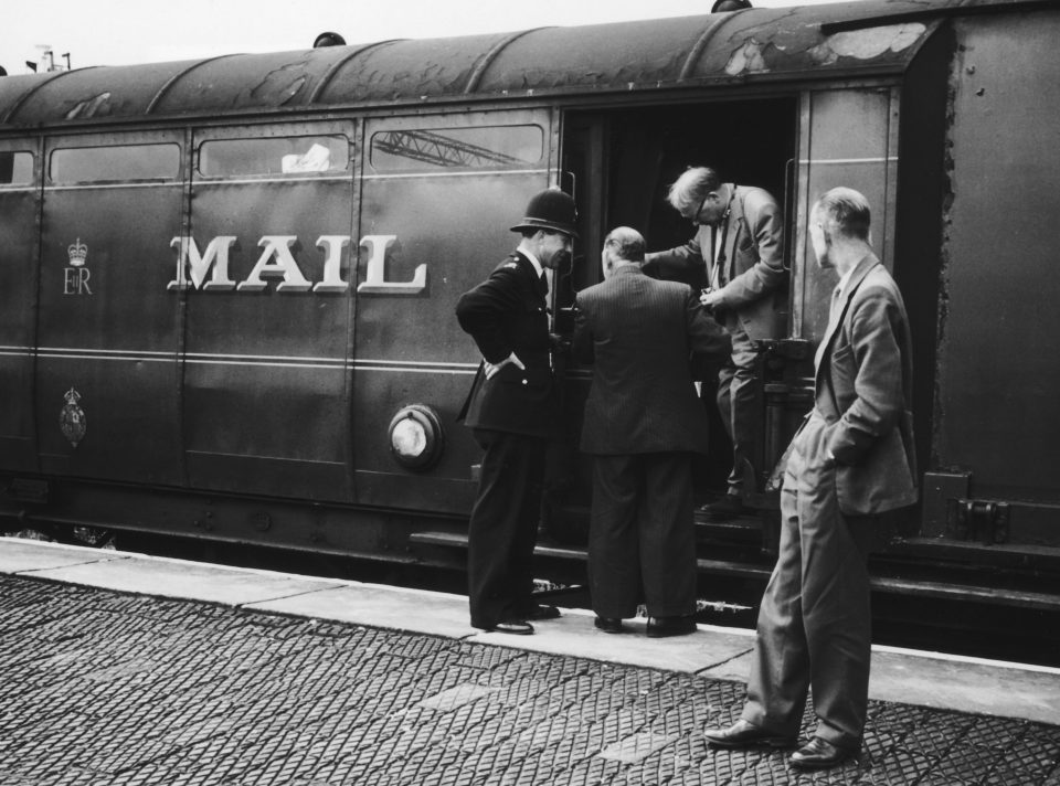  Police examining one of the coaches on the Glasgow to London travelling post office train near Bridego Railway Bridge in Buckinghamshire, England