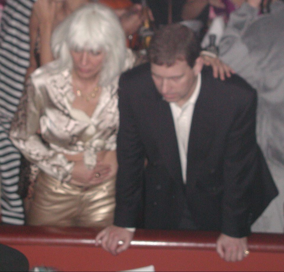  Ghislaine Maxwell in a blond wig puts her arm around Prince Andrew at Heidi Klum's 'Hookers and Pimps'-themed Halloween party in 2000