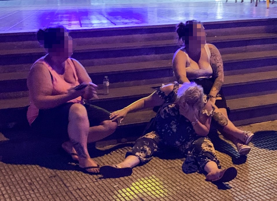  Brit tourists slump on the pavement after a night out on the town