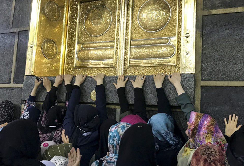  Muslim Hajj pilgrims touch the Kaaba stone as they circle around inside the Masjid al-Haram