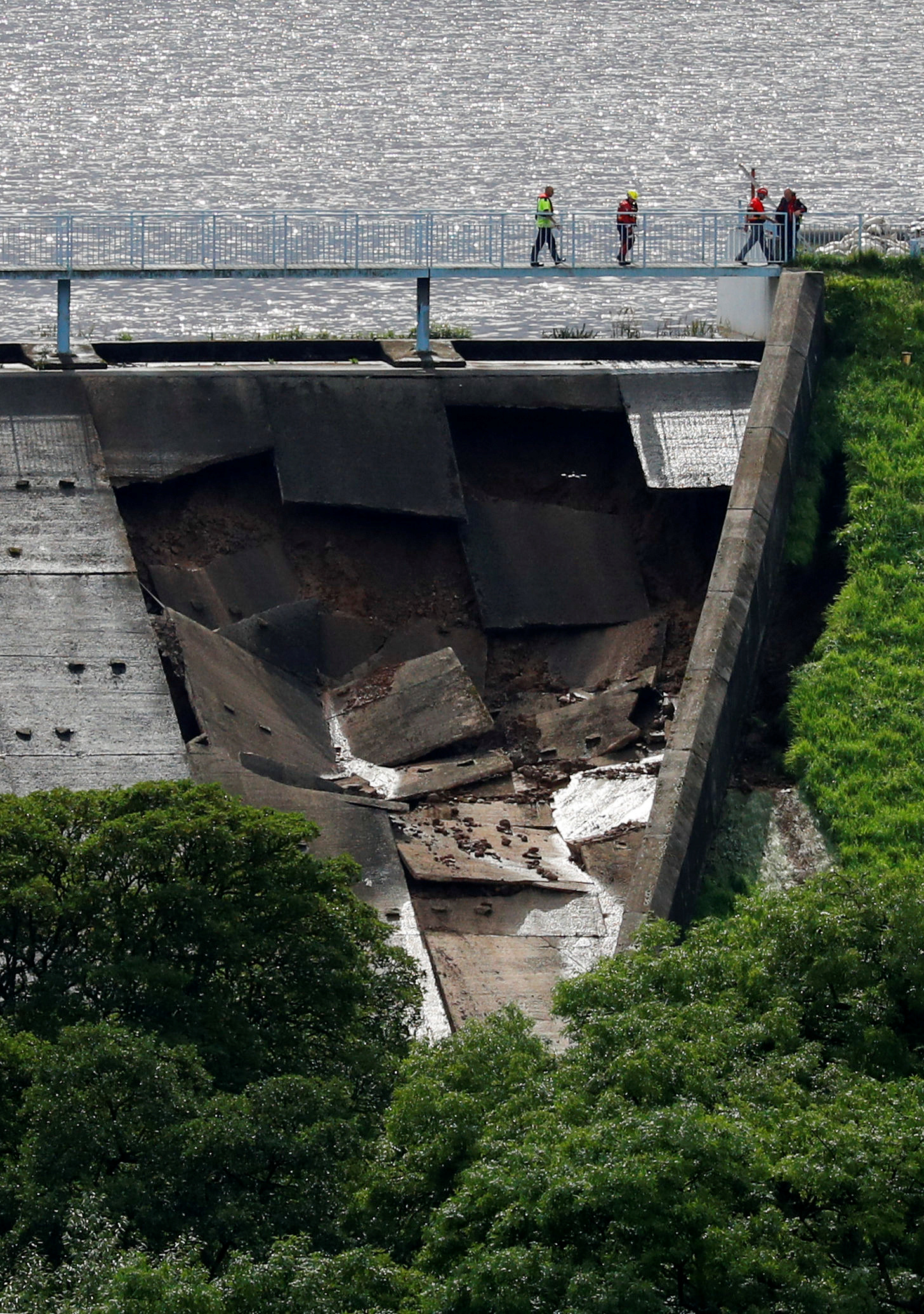 A massive hole can be seen in the dam, caused by high rainfall