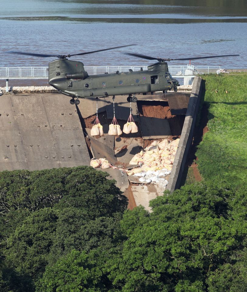  The huge helicopter can be seen in front of the damaged wall