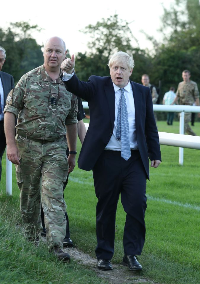  Boris Johnson arrives to meet emergency crews during a visit to Whaley Bridge