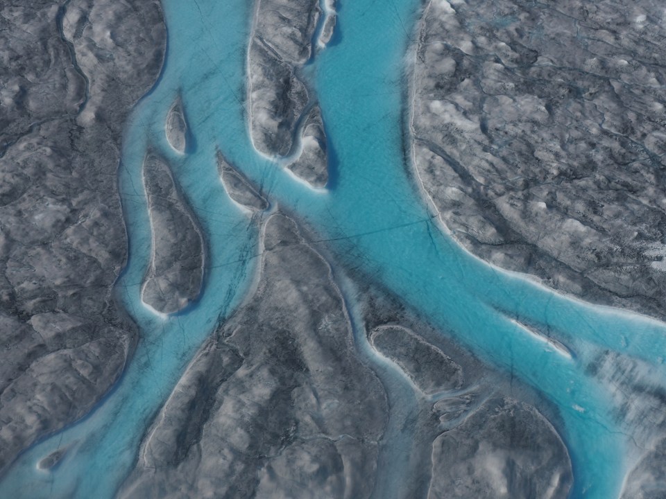  The melt water can be seen here in this aerial view of the ice sheet