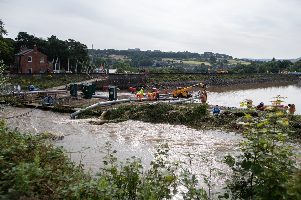  Workers are desperately trying to remove some of the water