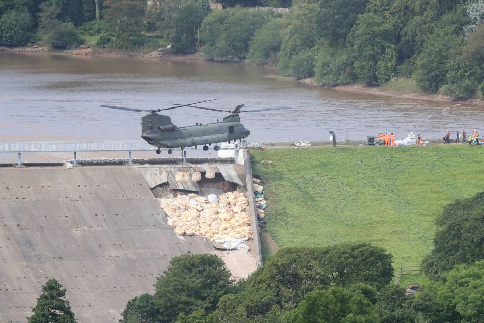  An RAF helicopter dropped 400 tonnes of aggregate on the collapsed section of the dam