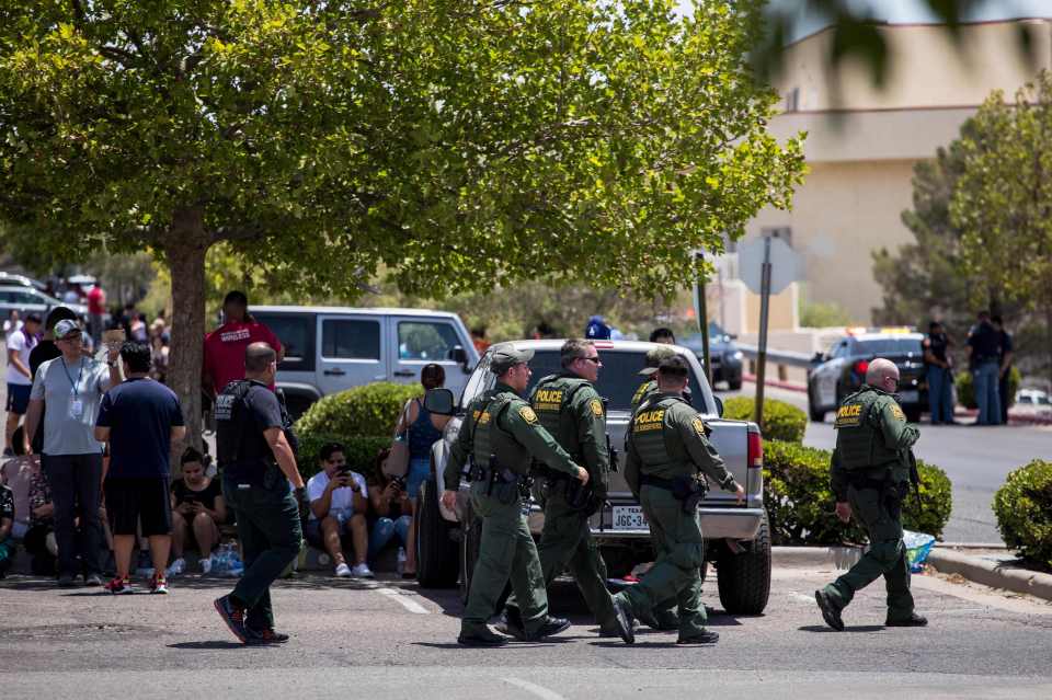  Authorities and evacuated shoppers outside the Walmart supermarket in El Paso last Saturday