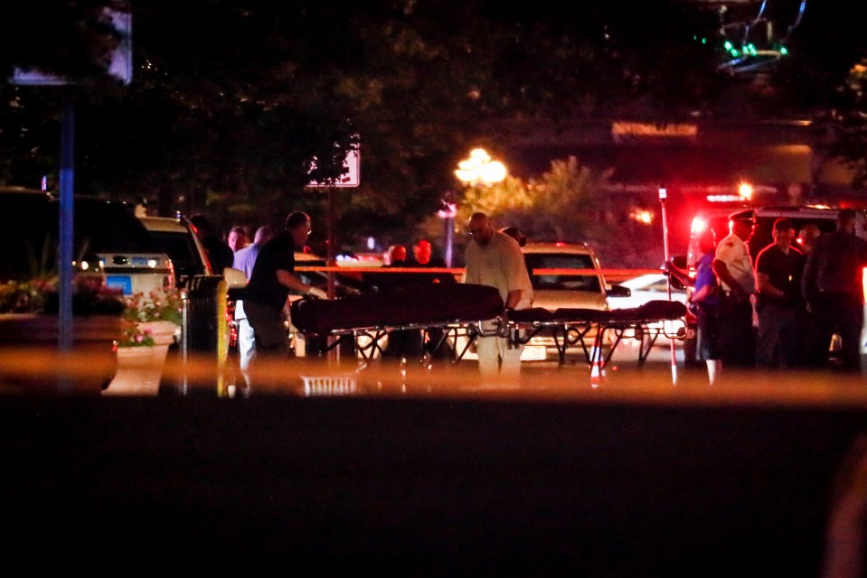  Emergency services remove bodies after nine were killed in a mass shooting in Ohio