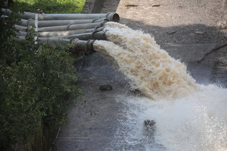  Workmen pumped almost two metres of water to make the dam as safe as possible ahead of the deluge