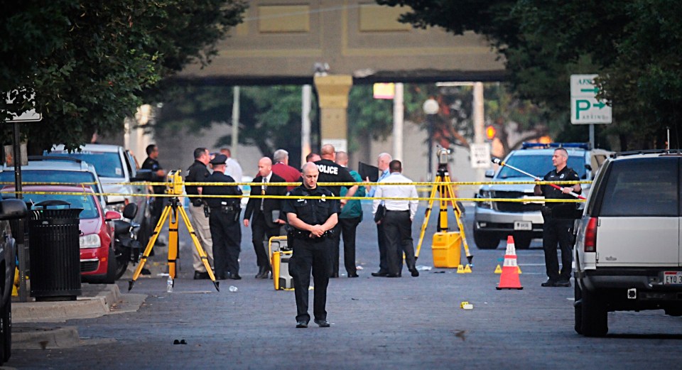  Cops survey the scene on August 4, hours after the horrendous shooting