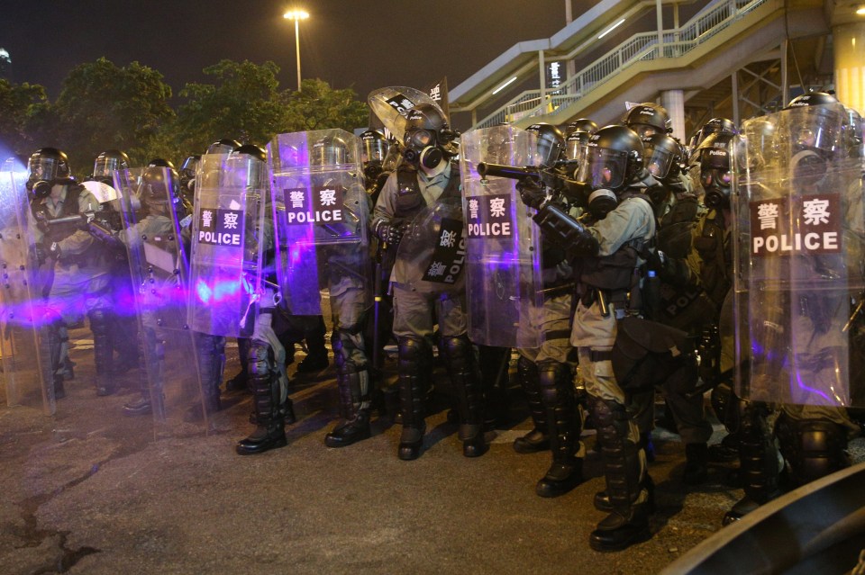  Riot police gather to disperse the protesters