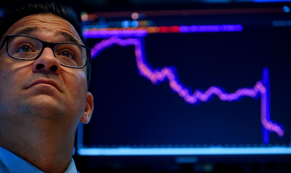  Trader looking glum at the New York Stock Exchange (NYSE) on August 5, 2019 at Wall Street in New York City