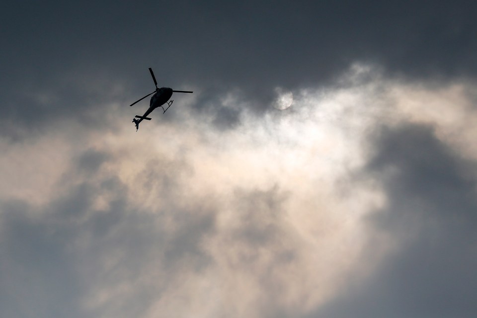  A helicopter buzzes over head as the search for Nora intensifies