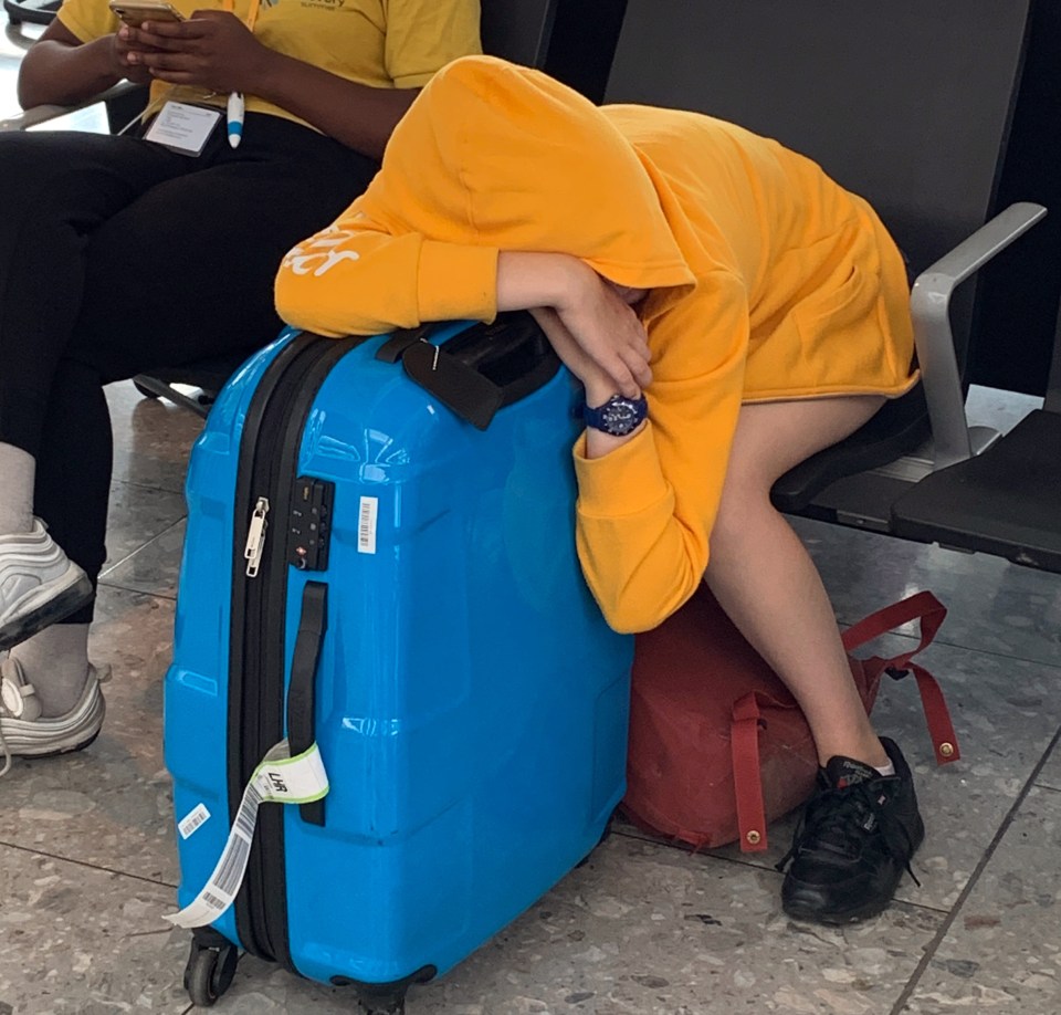  Tired passengers wait for their flights at Heathrow today