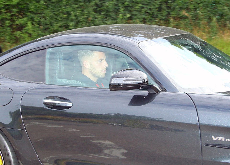  Toby Alderweireld drives past photographers in his Porsche