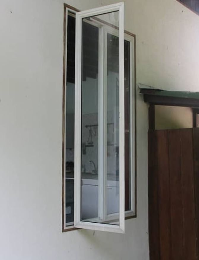 Police have released photos of a window they say was left open at the holiday resort cottage