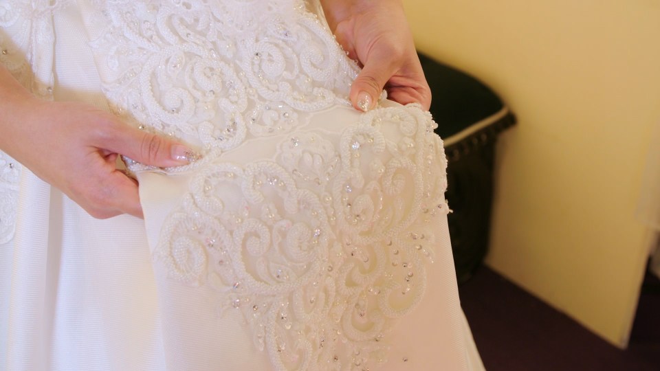  Gloria's white wedding dress featured over 2,000 crystals