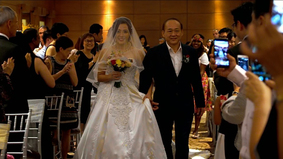  Gloria walked down the aisle in a white silk dress with over 2,000 crystals