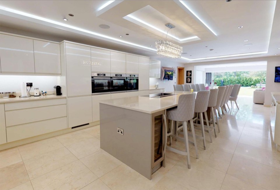  Danny's deluxe home also features an open plan kitchen, equipped with a marble island and a 10-seater dining room table