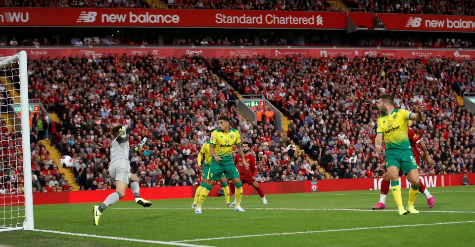 Norwich's Grant Hanley scores an own goal early on at Anfield