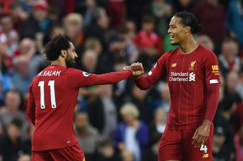 VVD celebrates scoring a towering header with team-mate Salah