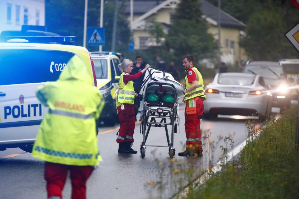  Medics with a stretcher near the al-Noor islamic center mosque where a gunman, armed with multiple weapons