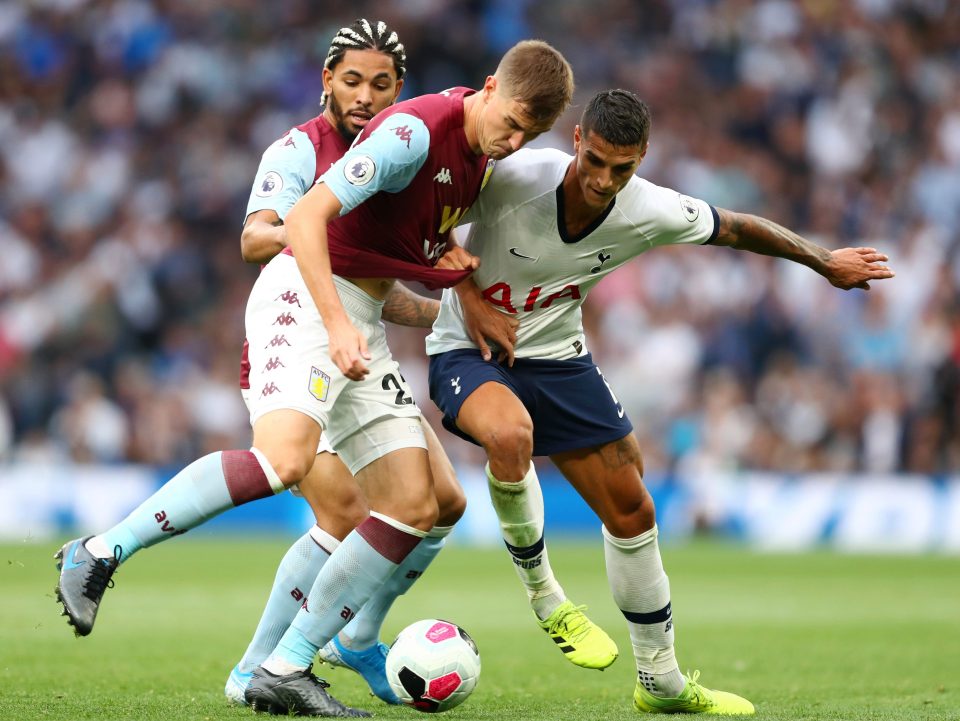  Erik Lamela, right, could not get into the game as the point in Spurs' diamond midfield