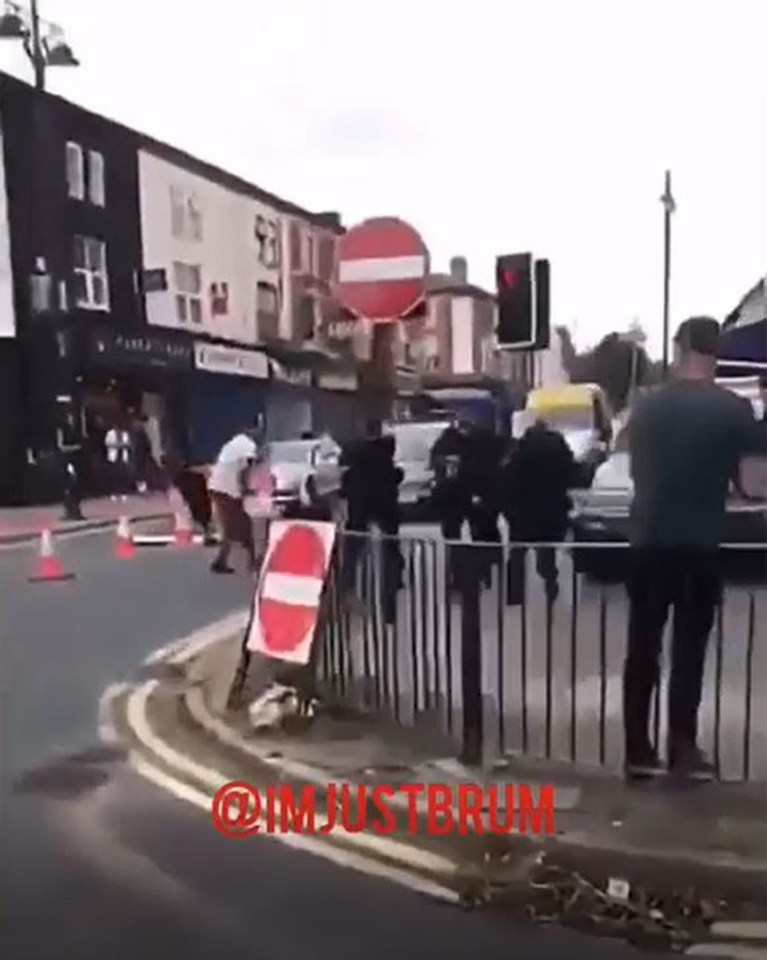  Chaos broke out on the street as police rushed to arrest a man who attempted to run down an officer