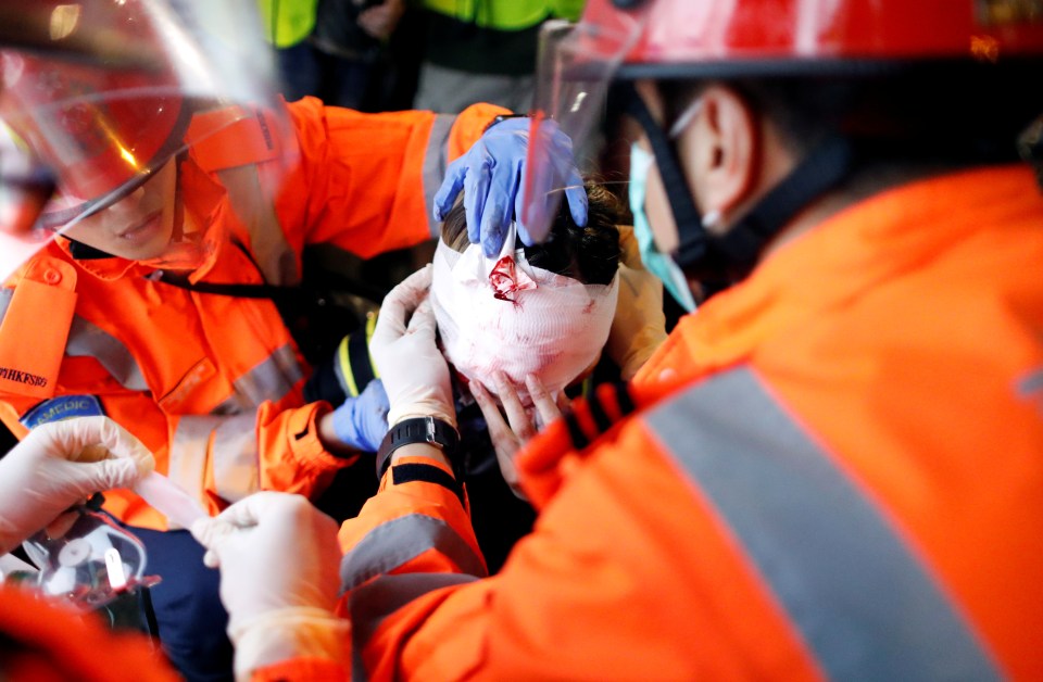  An injured protester receives treatment during widespread demonstrations