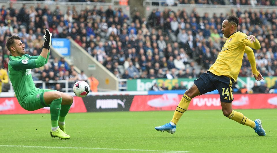  Arsenal striker Pierre-Emerick Aubameyang stabs home his crucial goal at Newcastle - his 33rd in 50 Premier League games