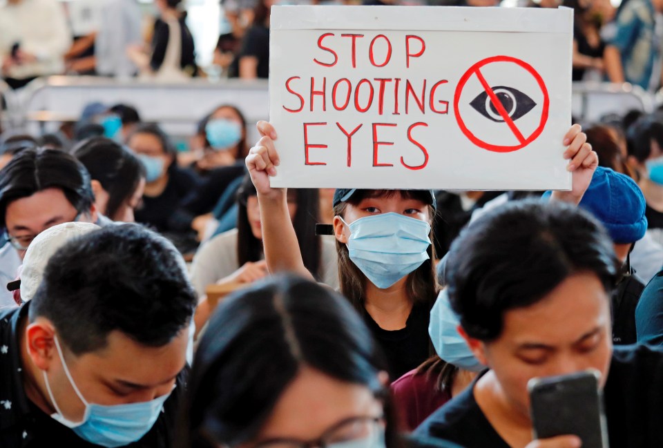  Many held signs like this during the fourth day of protests at the airport