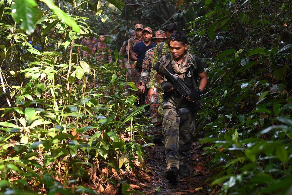  Members of the search team at the area where Nora's body was found