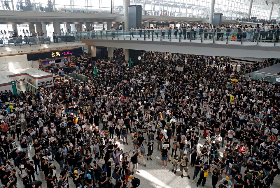  Thousands of demonstrators sit in the main terminal of Hong Kong's international airport