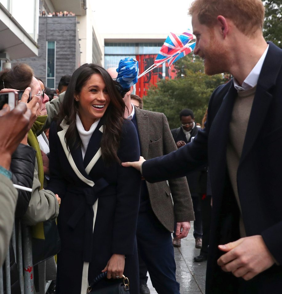  Harry reminds Meghan that he is there for her by grabbing her arm