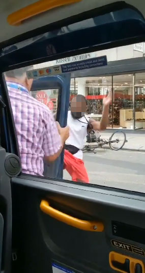  The cyclist takes aim at the driver's door with a karate chop move