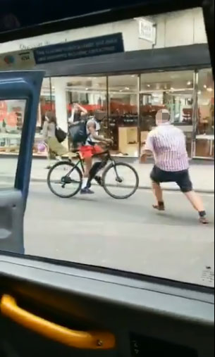  The furious cabbie approached the cyclist on foot