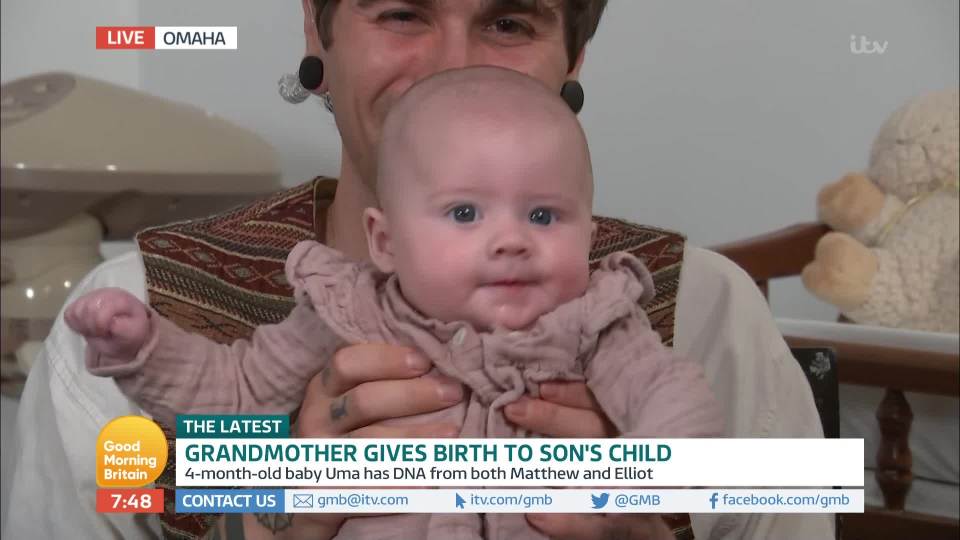  Elliot holds up baby Uma who was born using his sister's eggs fertilised with Matthew's sperm