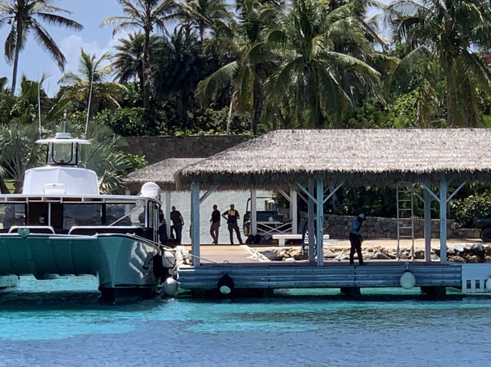 FBI officers can be seen arriving by speedboat at Jeffrey Epstein's 'paedo island'