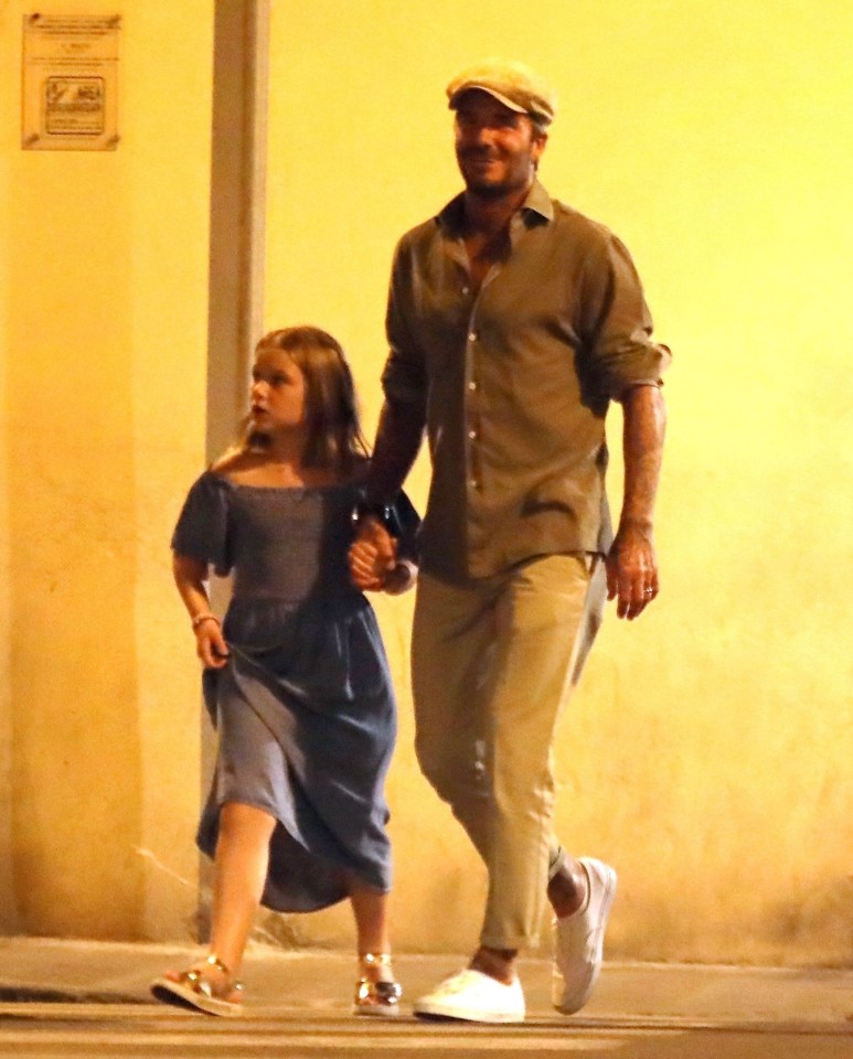  The dad-of-four smiled as he strolled down the Italian street