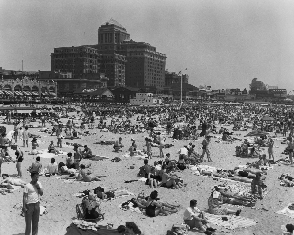  Beach-goers relaxing on a New Jersey beach before the spate of shark attacks terrorised the region