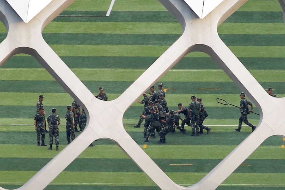  Chinese soldiers practice on the grounds of the Shenzhen Bay Sports Center