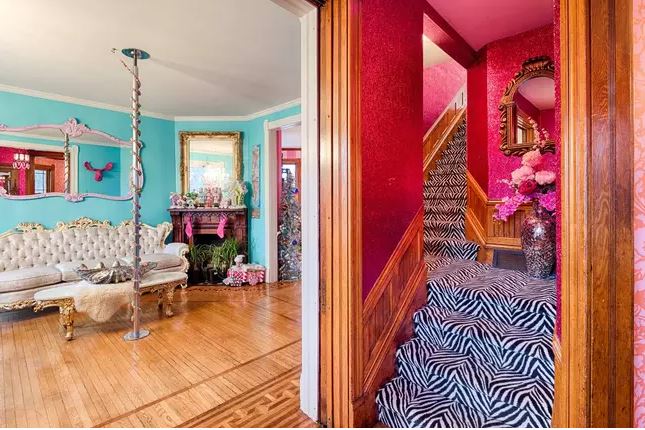  It isn't all pink, with zebra print carpets and glitter poles also found in the house