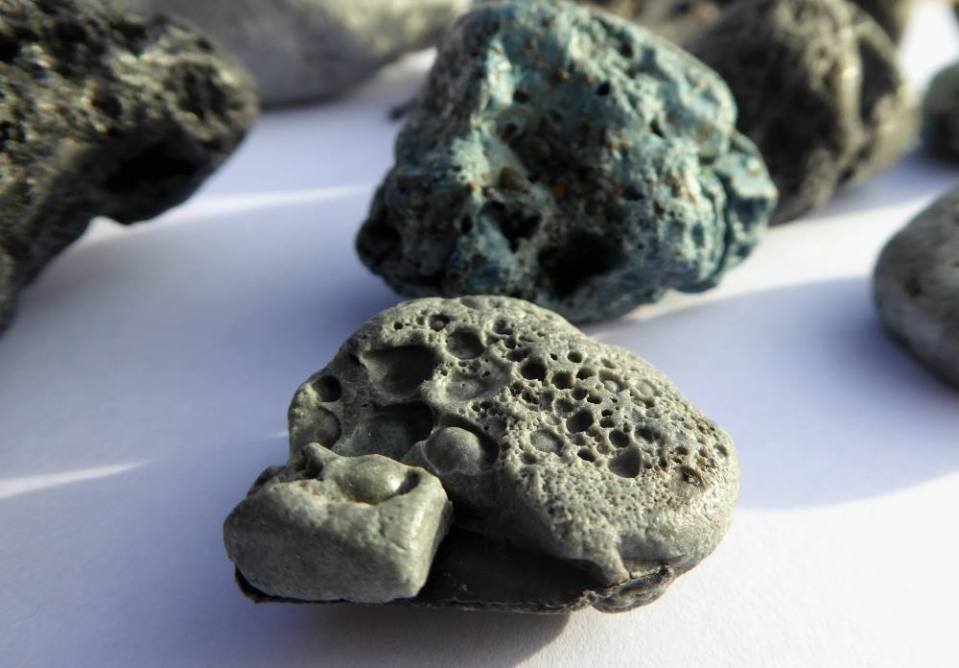  Chunks of grey, rounded plastic resembling rocks and stones are littering the Cornish coast